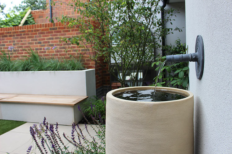 Butterfly ecouraged by planting settles on feature lantern